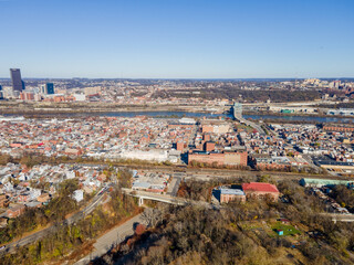 Wall Mural - Aerial cityscape with river and fall foliage in residential Pittsburgh Pennsylvania