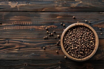 Poster - A wooden bowl filled with peppercorns on a table. Suitable for food and cooking concepts