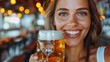 A woman holding a beer glass, smiling happily at the bar