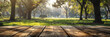 A wooden table in a park with a blurred background, perfect for outdoor leisure and relaxation.