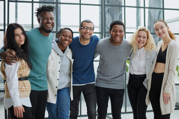 Wall Mural - Group of business people standing at the window of a modern office