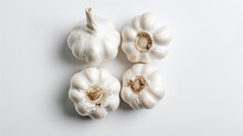 Photo Of Four Garlic On A White Background, Studio Shot From A Low Angle With Natural Light On A White Background.