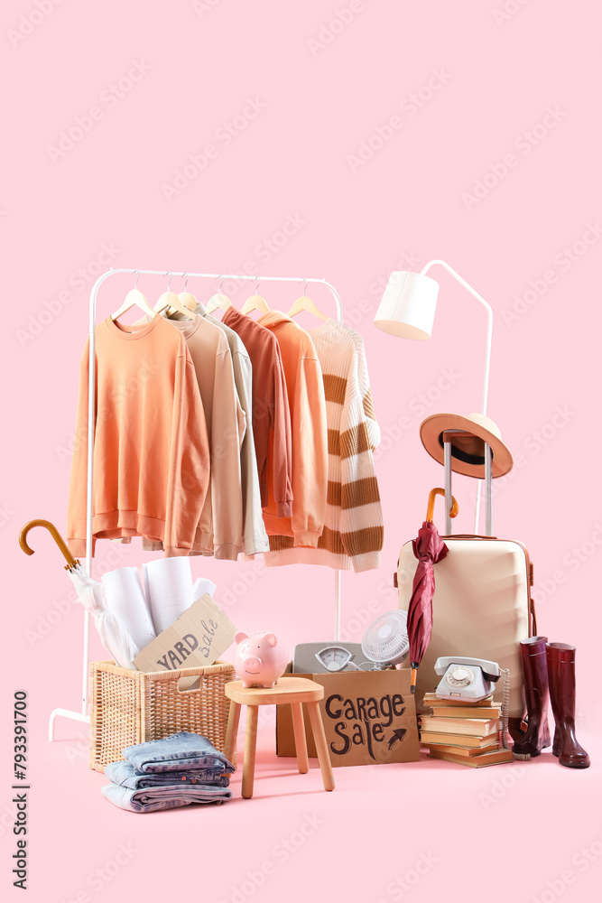 Unwanted stuff for garage sale on pink background