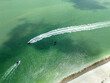 Overhead view of boats moving through the ocean water in the Gulf of Mexico