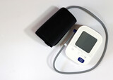 Fototapeta Kosmos - Blood pressure monitor medical diagnostic device. Digital blood pressure monitoring device on a white background.