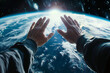 Two hands reaching towards the earth from space