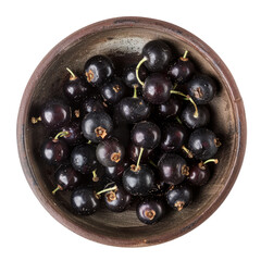 Wall Mural - A close up top view of some juicy organic blackcurrant berries situated on a rustic clay dish isolated against a transparent background
