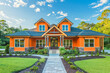 A front view of an elegant tangerine craftsman cottage style home, with a triple pitched roof, immaculate landscaping, a paved walkway, and superior curb appeal, showcasing a zest for modern living.