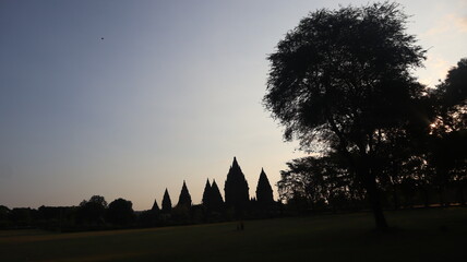 View of the temple in the ancient Prambanan temple complex with the evening sky in the background. Popular tourist destination.