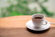 cup of coffee on wooden table