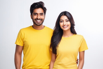 Young couple in yellow color t shirts on white background