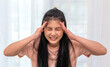© JOURNEY STUDIO7 - Asian woman holding and touching on head feel suffering head ache pain flu high fever, alzheimer, cancer, sick, brain, stroke, parkinson, disease, migraine, encephalitis, dementia.woman healthcare.