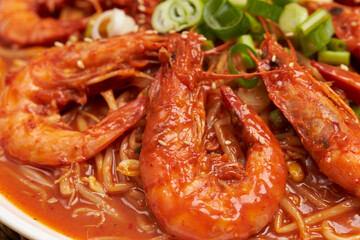 Wall Mural - Steamed squid and shrimp mixed with vegetables and spicy sauce