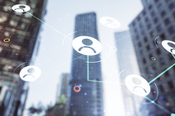 Poster - Double exposure of social network icons hologram on blurry cityscape background. Networking concept