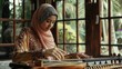 © sambath - A dynamic shot of a young Asian Muslim woman playing a musical instrument.