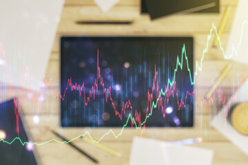 Poster - Multi exposure of abstract financial graph and modern digital tablet on desktop on background, top view, financial and trading concept