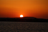 Fototapeta Dmuchawce - Sunset on the coast of the Cyclades island of Naxos-Greece
