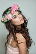 Beautiful healthy woman with clean fresh skin, wavy long hair and flower wreath, beauty portrait