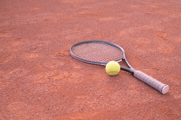 tennis racket and ball on court