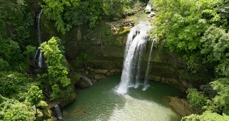 Wall Mural - Top view of Waterfall in the rainforest. Tropical Ben-Ben Falls in mountain jungle. Negros, Philippines.