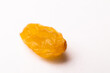 macro photography of raisins on a white background, side view. close-up of one piece of raisin