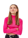 Fototapeta Natura - Portrait of fourteen year old teenager in braces dreaming about something isolated on white background. Blondy caucasian girl in pink turtleneck looks up and posing in studio.