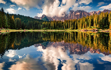 Wall Mural - Colorful summer view of Carezza (Karersee) lake. Wonderful morning scene of Dolomiti Alps, Province of Bolzano, South Tyrol, Italy, Europe. Beauty of nature concept background.