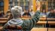 © ЮРИЙ ПОЗДНИКОВ - Gesture in classroom as man raises hand to answer question