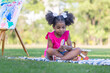 Child girl playing outdoors, Cute little girl play in the garden, Pretty baby girl kid eating ice cream