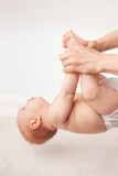 Fototapeta  - Physiotherapist Conducting Development Exercises with Infant in Clinic