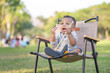 Cute little kid boy playing outdoors in the park, Cheerful child boy play in the garden