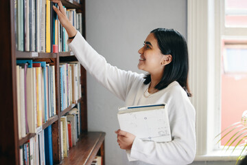 Sticker - Studying, woman and student in library, books and school with education, smile and bookshelf. Happy person, college and girl with novel, literature and university with scholarship and knowledge