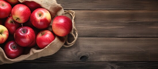 Poster - Bag full of apples on wooden table