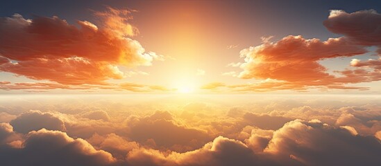 Wall Mural - A sunset above clouds with a brilliant sun