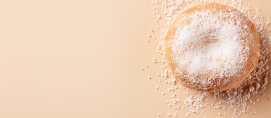 Wall Mural - Powdered donut on table with spoon