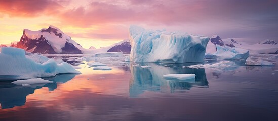 Wall Mural - Icebergs drifting in water with distant mountains