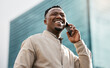 Phone call, business and laughing black man in city for talking or consultant listening to contact in low angle. Mobile, funny and African professional outdoor for deal, negotiation or travel news