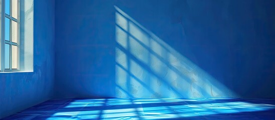 Electric blue sunlight creates geometric shadows on floor from window