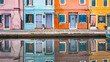 Colorful houses with reflections on the canal in Buran