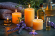 Candles and bottles of essential oils, lavender flower ,for a sense of relaxation and tranquility