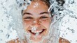 Happy woman smiling under refreshing stream of water from faucet in bathroom shower