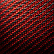 Fondo con detalle y textura de superficie con patron geometrico negro y rojo con trama cruzada
