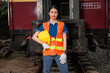 portrait Asian young teen engineer worker standing happy smile outdoor waring safety reflective with hardhat.