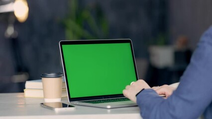 Close Up Shot Of Hands Of Freelancer Working With Green Screen Laptop. Chroma Key Display Laptop. Woman Using Trackpad Scrolling Through Website On Computer