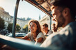 joyful couple enjoys a bus tour in a blurry city