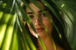 © Generative ART - Cheerful Young Woman Peering Through Lush Palm Leaves In Natural Light