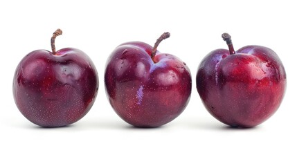 Wall Mural - Plum colored plums set apart against a white background