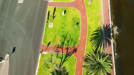 Canvas Print - Promenade along the city river, aerial view on a sunny day