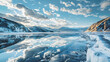Ice on the shore of lake. Mountains and sky 