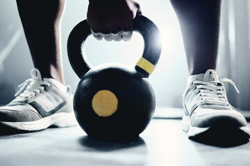 Poster - Person, hand and kettlebell on floor at gym for strength training, fitness and sports challenge. Athlete, bodybuilder and workout equipment on ground for muscle exercise, endurance and body care